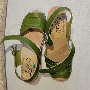 Beautiful green clogs, ankle strap. Excellent condition. Size 35. Made in Sweden